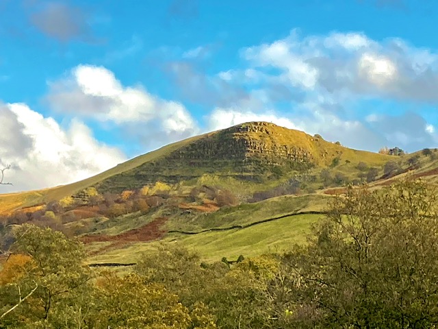 Scenic mountain views with lush greenery and rolling hills, showcasing the natural beauty surrounding the luxury cottage